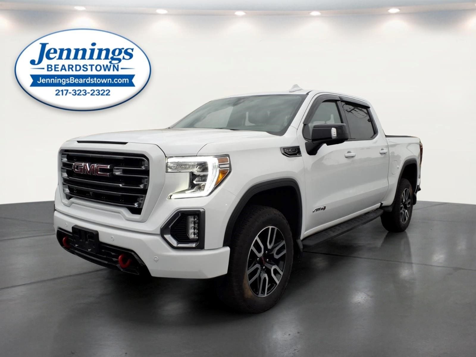 2021 GMC Sierra 1500 4WD Crew Cab Short Box AT4 in Summit White — front three-quarter view